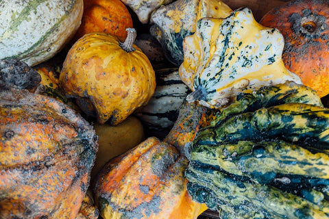 yellow and green squash on brown wooden table